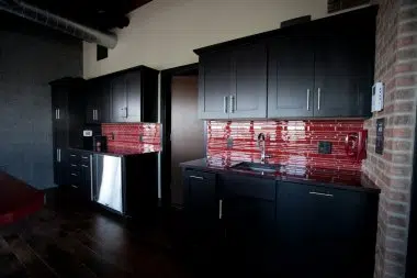 Sleek and contemporary  with dark shaker cabinetry 