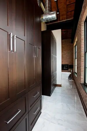 Additional Storage matching the dark contemporary cabinetry from master bath vanity 