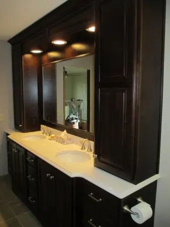 Tall vanity towers flanking sinks adding extra storage 