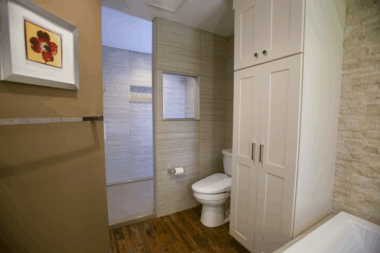 Entry into the walk-in shower with the stone tile to add texture