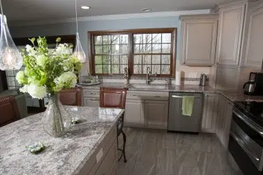 Big window over the sink allows for natural light to flood in