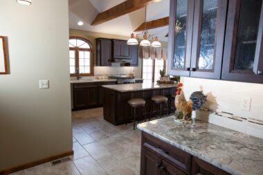 Butler pantry has textured glass doors which gives interest and great storage 