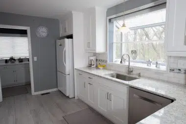 Large window over sink allows for a lot of natural light and a view 
