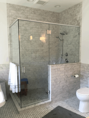 Custom white painted cabinetry and Moen fixtures in polished chrome throughout